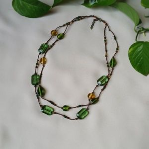 Green and yellow beaded necklace, knotted cord